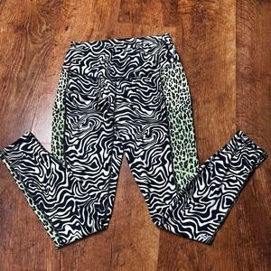 Fabletics Zebra print leggings with neon green leopard mesh pockets and accents